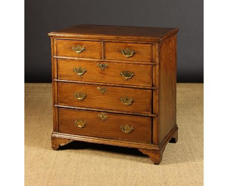 An 18th Century Ash Chest of Drawers bordered in diagonally grained banding. The top having applied edge moulding above two s