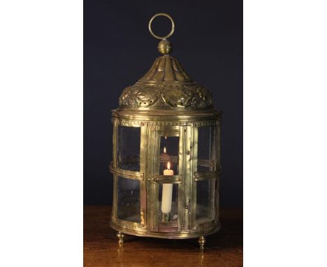 A Large Late 18th/Early 19th Century Dutch Brass Lantern.  The cylindrical body with glazed sides in a studded strap frame, s