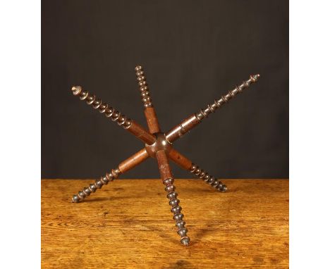A 19th Century Mahogany Cat with delicate reel turned decoration, 9 ins (23 cms) in height, 10½ ins (27 cms) span.