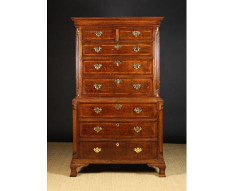 An 18th Century Inlaid Oak Chest on Chest. The upper section having a moulded top above two short and three long drawers inla