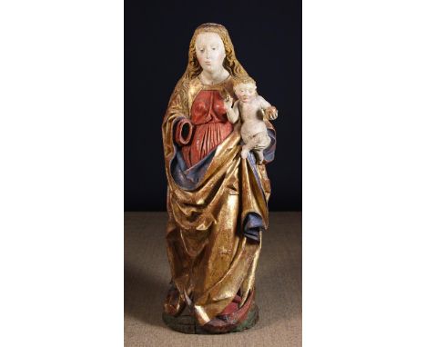 A Fabulous 15th Century German Polychromed Limewood Carving of The Virgin & Child, Circa 1450. The sculpture carved in high r