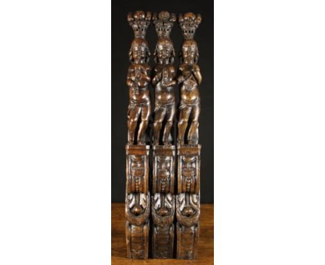 A Set of Three 17th Century Figural Pilasters Carved with Cherubic Musicians playing bagpipes, drum and tambourine; each figu