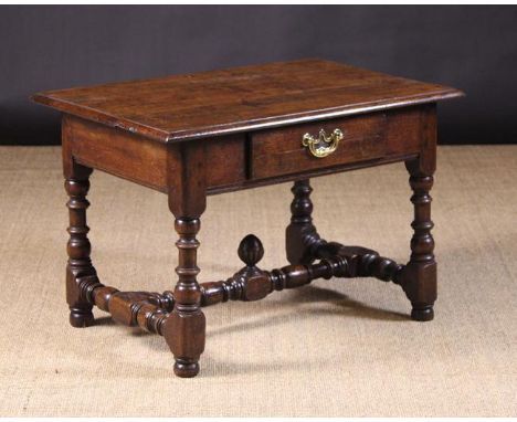 A 17th Century Joined Oak Low Side Table.  The top with moulded edge above a single pine lined drawer with replacement handle