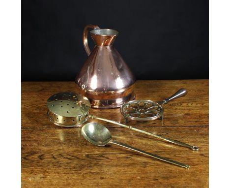 A One Gallon Copper Measure, a copper-bottomed brass chestnut roasting pan, a brass trivet with turned wooden handle, and a s