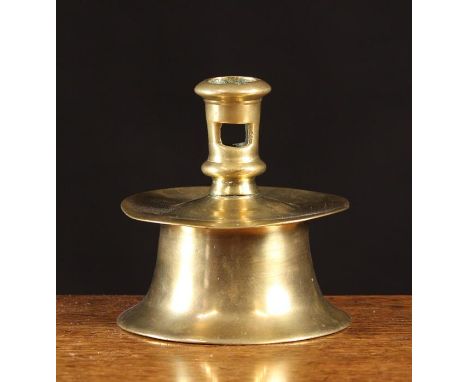 A 16th Century Brass Capstan Candlestick.  The socket with lateral cut ejector on a truncated bell base with integral drip pa