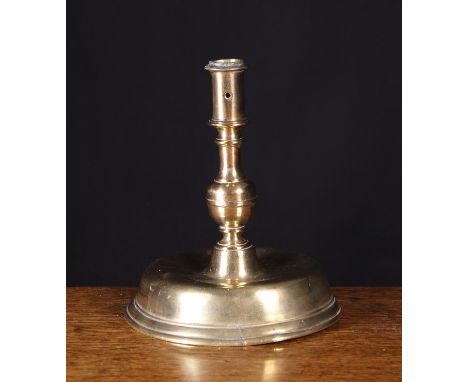 A 17th Century Spanish Brass Candlestick, Circa 1690. The cylindrical nozzle pierced with two round extraction holes above a 