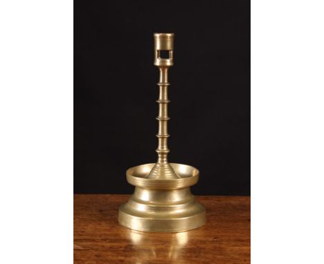 A Fine Gothic Brass Flanders Candlestick Circa 1500. The socket with lateral cut stub ejector on a slender stem having five b
