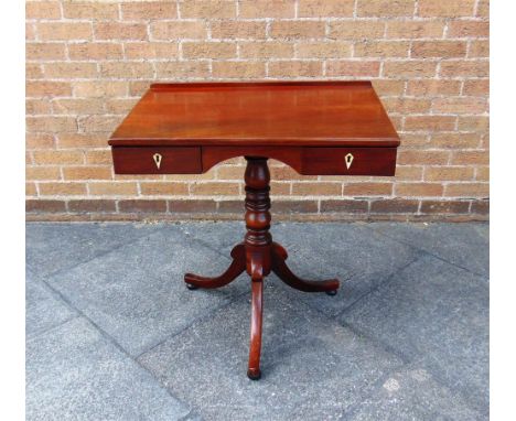 A MAHOGANY OCCASSIONAL TABLE fitted with two drawers raised on turned pedestal with outswept tripod supports, 74cm wide, 51cm