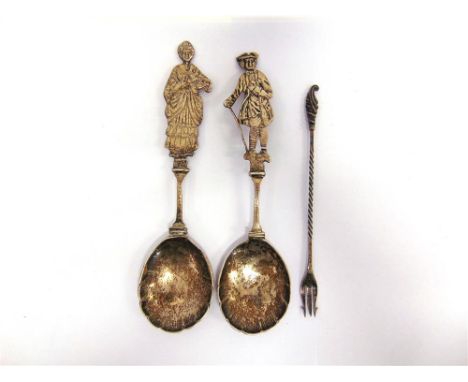 A PAIR OF SILVER SPOONS by Nathan & Hayes, Birmingham 1892, with cut out figural finials, one of a lady in 18th century dress