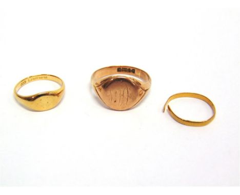 A 9CT GOLD SIGNET RING 6.5g gross; with an 18ct gold signet ring, 4g gross; and a 22ct gold wedding ring, 0.9g gross