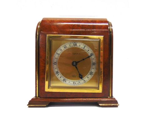 AN ELLIOTT MANTEL CLOCK the gilded square dial with a silvered chapter ring and Roman numerals, the Art Deco style mahogany c