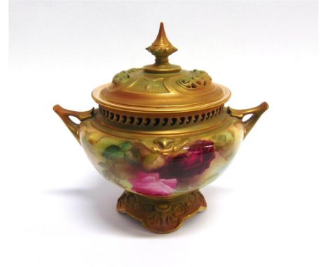 A ROYAL WORCESTER POT POURRI AND COVER painted with roses on a blush ivory ground, heightened in gilt, the lid and body with 