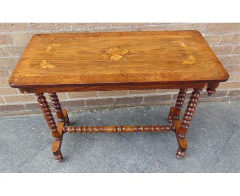 A VICTORIAN PARQUETRY DECORATED SIDE TABLE the top inlaid with butterflies and a floral motif to centre, on bobbin turned bas