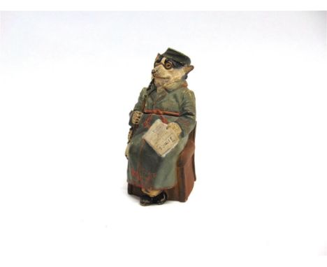 A NOVELTY TOBACCO JAR MODELLED AS A SEATED BADGER with pipe and newspaper.