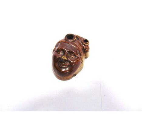 A 19TH CENTURY STONEWARE 'SOUTER JONNY' NOVELTY INKWELL in the form of a capped characterful head, with a brown glaze, the ba