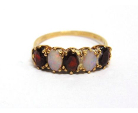 AN OPAL AND GARNET FIVE STONE 9CT GOLD RING finger size U1/2, 2.8g gross