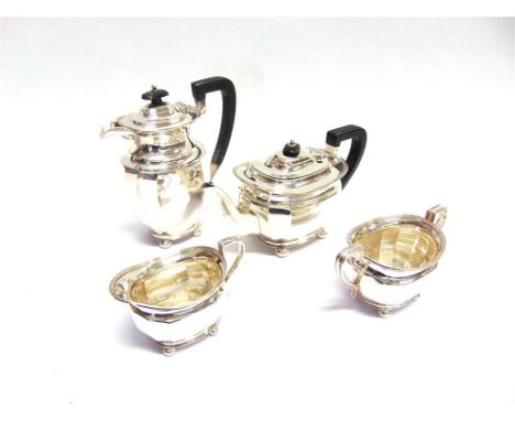 A MATCHED FOUR PIECE SILVER TEA SERVICE by H. Atkin, Sheffield 1929-31, of oval canted corner outline on ball feet, 1446g (46