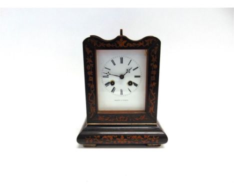 A 19TH CENTURY FRENCH MANTLE CLOCK the ebonised case with foliate inlay, the white enamel dial with Roman numerals signed 'Th