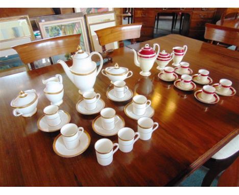 A ROYAL DOULTON 'ROYAL GOLD' PATTERN COFFEE SERVICE comprising coffee pot, twin sucriers with covers, cream jug, nine cans an