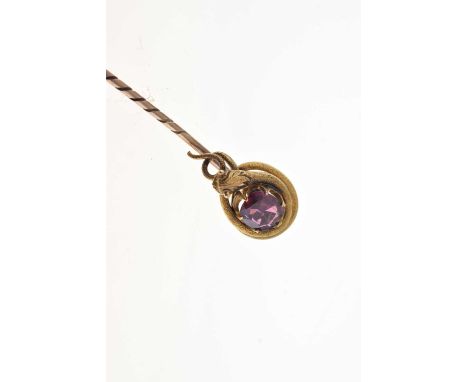 A garnet set serpent stick pin; the reptile coiled around the cushion shaped stone, cased