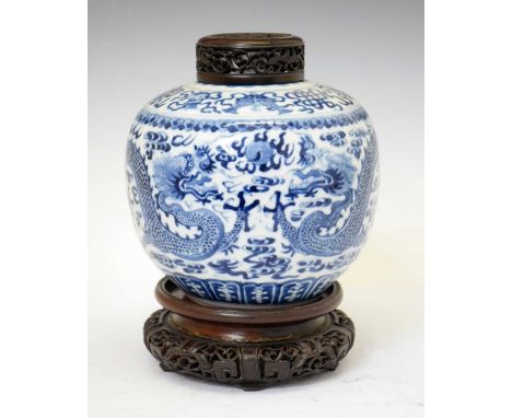 Chinese blue and white porcelain ginger jar, painted with four-toed dragons amidst clouds between borders, seal mark to base,