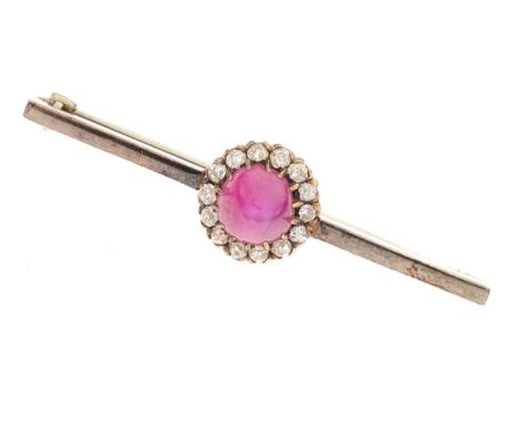 Star ruby and diamond bar brooch, in unmarked white metal, the steep cabochon enclosed by fourteen small diamonds, the bar ap