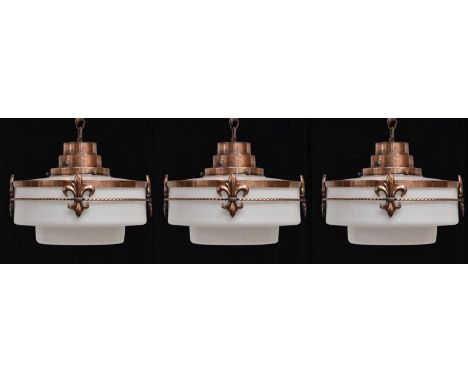 Set of three opaque glass Art Deco pendant lights, each of stepped cylindrical form with stepped surmount, the body enclosed 