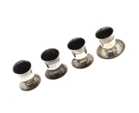 Set of four continental white-metal miniature goblets, 1.3cm high, together with four unmarked associated saucers