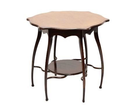 Early 20th Century Art Nouveau mahogany centre table, of E. W. Godwin influence, the shaped hexagonal top raised on downswept