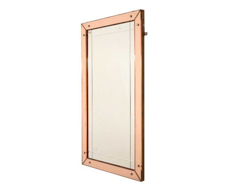 Art Deco wall mirror, the tinted pink glass sectional perimeter plates enclosing rectangular plate with cut and bevelled bord