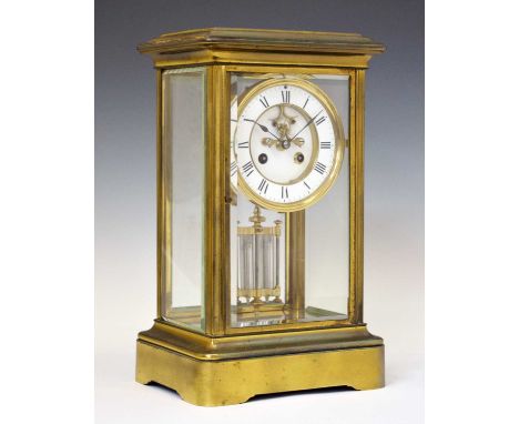 Late 19th Century French lacquered brass four-glass mantel clock with white enamel Roman chapter ring framing recessed centre