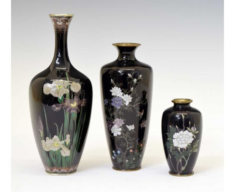 Three Japanese Meiji period dark blue ground cloisonné enamel vases, comprising one of octagonal baluster form with flared at