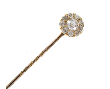 A diamond cluster stick pin, the central old brilliant cut estimated as weighing approximately 0.5cts, enclosed by ten smalle