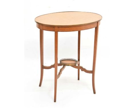 Early 20th Century satinwood and marquetry occasional table, the oval top within gilt metal surround raised on slightly downs