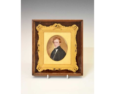 Mid 19th Century English School - Watercolour on ivory - Portrait miniature of a young gentleman wearing a black frock coat, 