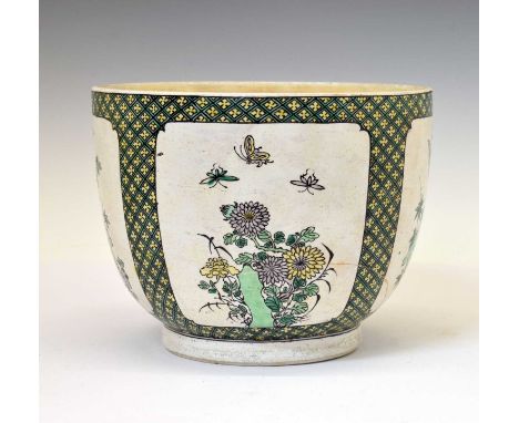 Chinese Kangxi Famille Verte porcelain jardinière, of tapered footed form, painted with panels of flowering foliage, rockwork