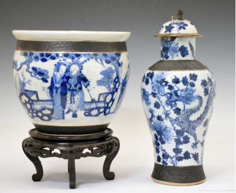 Chinese blue and white crackleware Meiping vase and cover, painted with two dragons amid flowering foliage bewteen bronzed bo