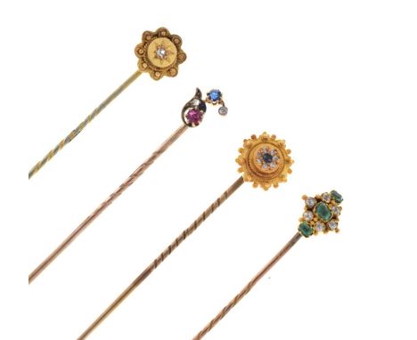 A single stone diamond stick pin; another similar; a ruby, sapphire and diamond stick pin; and a diamond and emerald set stic