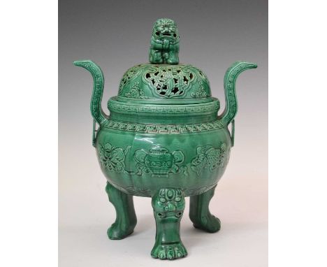 Early 20th Century green glazed pottery incense burner, modelled in the Chinese taste with seated temple dog to foliate pierc