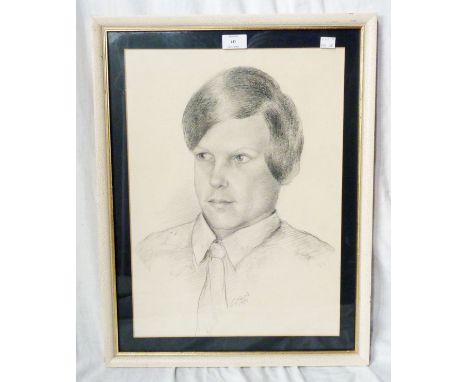 A framed 1974 pencil portrait of a young man