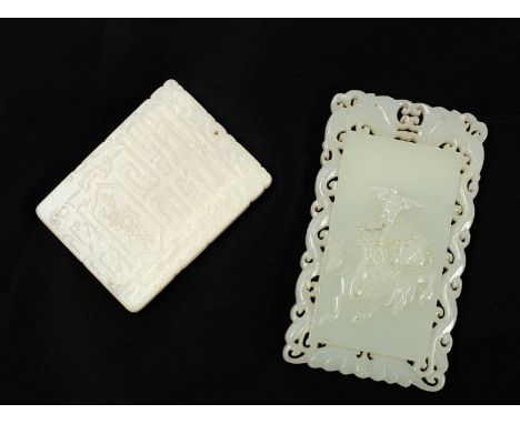 Two Chinese carved jade plaques, the larger centred by a horseman and with a carved pierced border, 9.5cm x 5.5cm, the smalle