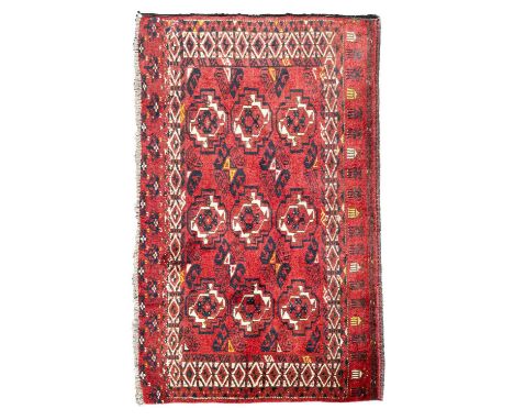 An Kizil Ayak chuval Ersari, circa 1920, the deep madder field of four quartered Yomut guls, framed by an ivory Kufic type bo