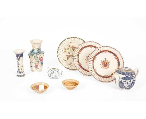 A mixed lot of Chinese ceramics, to include a blue and white teapot, a famille rose vase, a pair of tea bows, plates (9)Trump