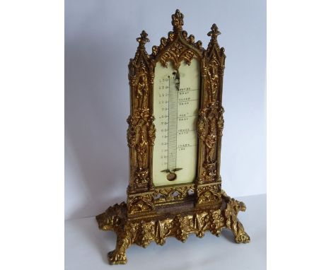 A 19th century cast gilt-metal thermometer stand in high Gothic style; with ivory register plate but now minus a thermometer 