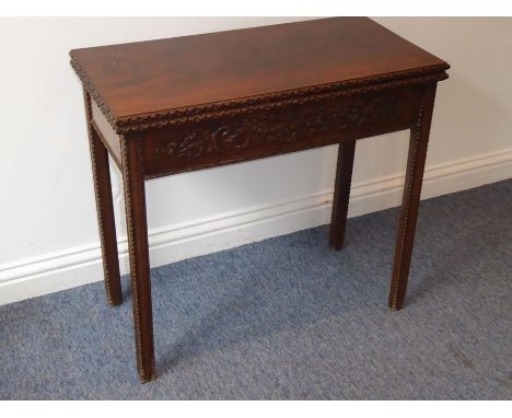 A mid-18th century mahogany fold-over-top card table; the figured top above the two edges opening to reveal green-baize inter