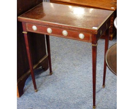 A late 19th century brass-mounted fold-over top card table, the quartered veneered top above a frieze with classical-style Ja