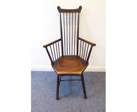 An early 20th century Arts and Craft style stick-back chair of primitive inspiration; dished hexagonal seat and slightly spla