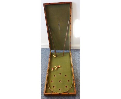 A 19th century mahogany bagatelle board with accessories etc.