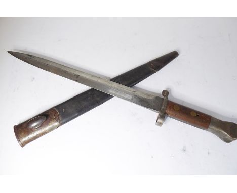 A British Pattern 1888 Mk 1 Type 2 (Lee Metford rifle) bayonet; 11½" blade, the wooden grips drilled through for mounting, in