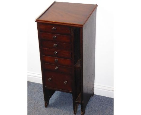 A 19th century mahogany printer's side cabinet; angular galleried top over drawers with compartmentalised interiors and a lar